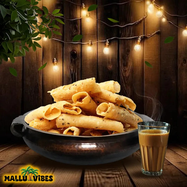 Front view of Mallu Vibes Homemade Fresh kuzhalappam in a bowl , english - Online Kerala snacks crispy rice tubes