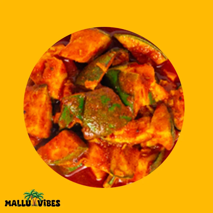 Top view of Mallu Vibes Homemade Kerala pickles and No Preservatives Mango pickle with chunks of ripe mangoes, malayalam - manga achar