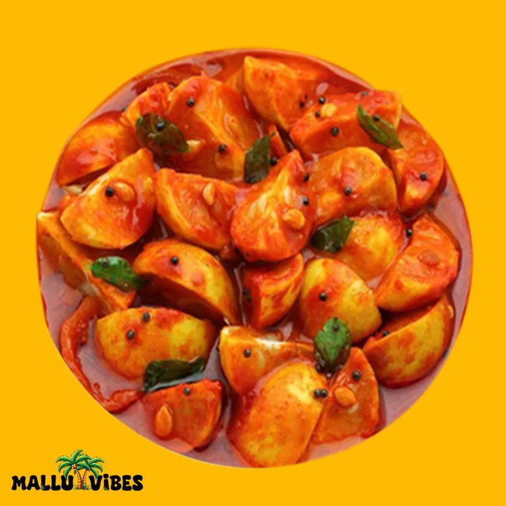 Top view of Mallu Vibes lime Kerala pickles with vibrant yellow green limes Homemade Kerala pickles and No Preservatives, malayalam - naranga lemon achar 