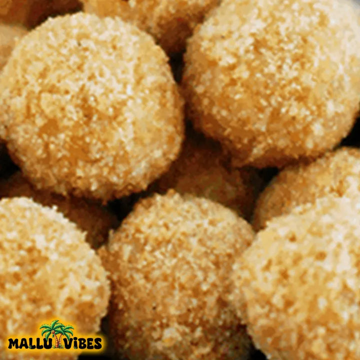 Top view of Natural Kerala snacks Avalose unda in a bowl, english - Homemade Fresh Traditional Kerala food Avalose unda or sweet rice coconut balls